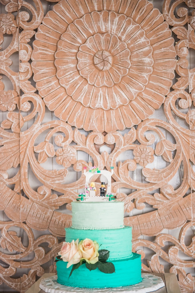 Mint green ombre wedding cake with a LEGO cake topper and buttercream