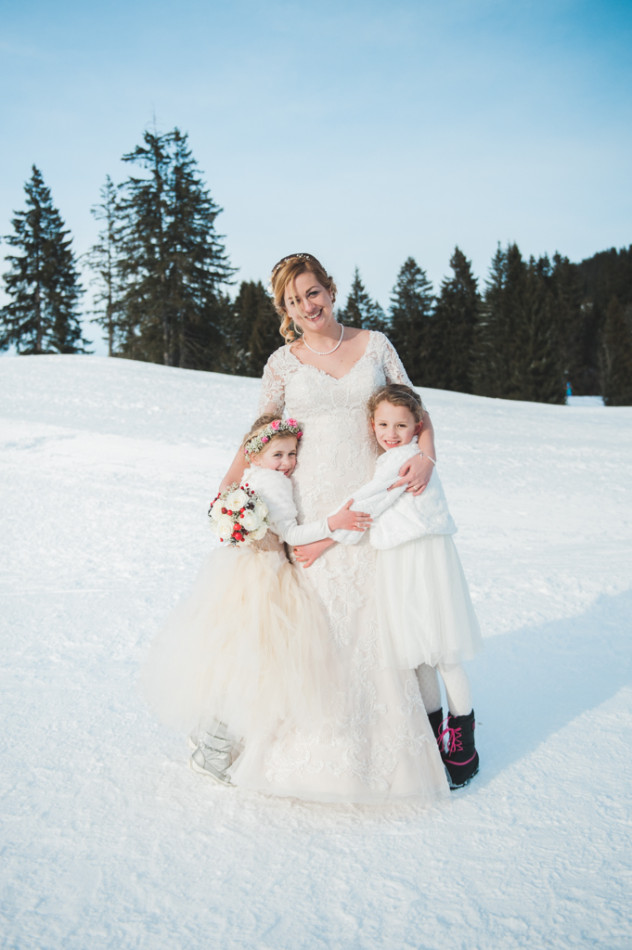 A bride with her flower girls at a winter wedding in Tyrol in Austria
