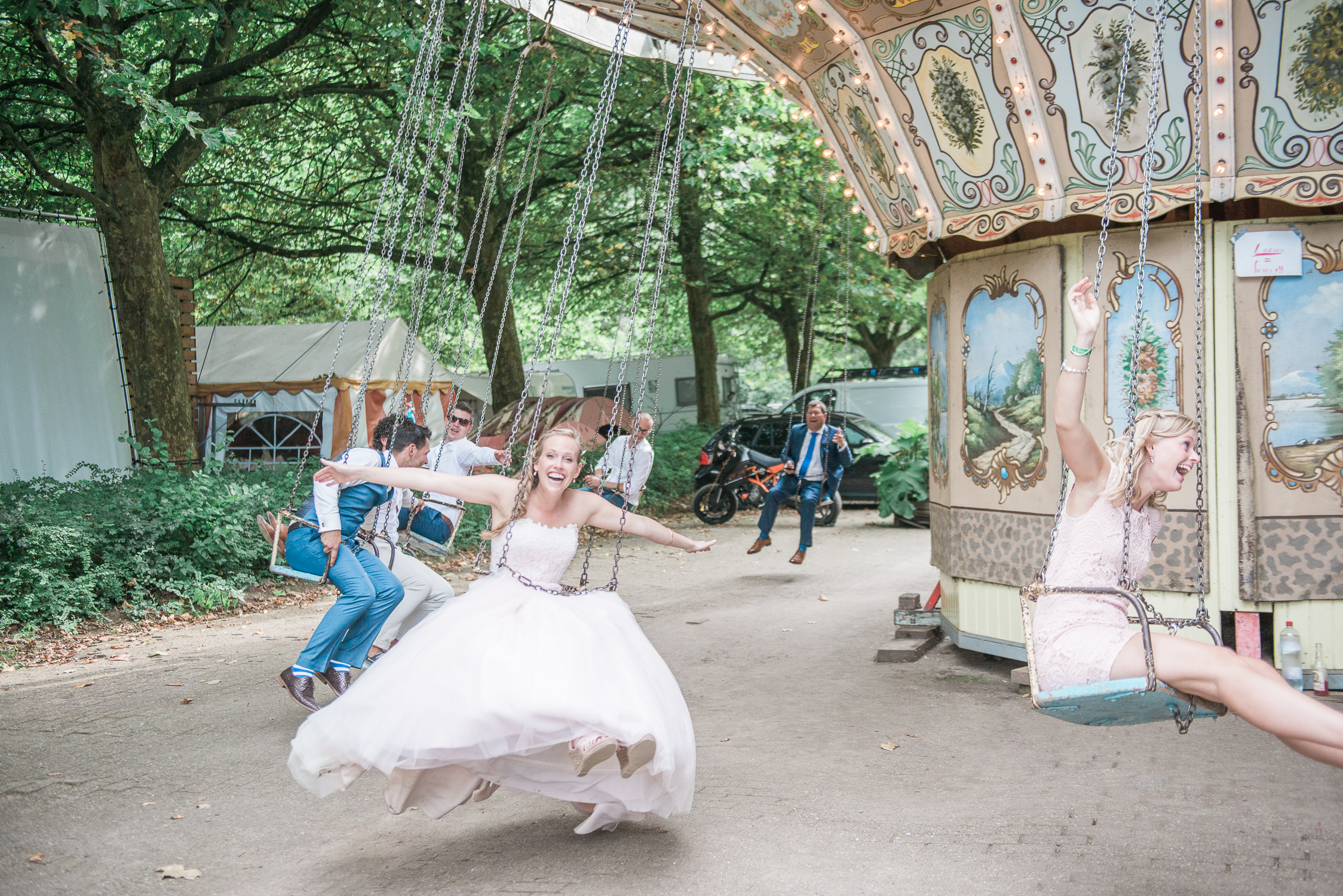 Bride in a carousel at a festival wedding at de lievelinge
