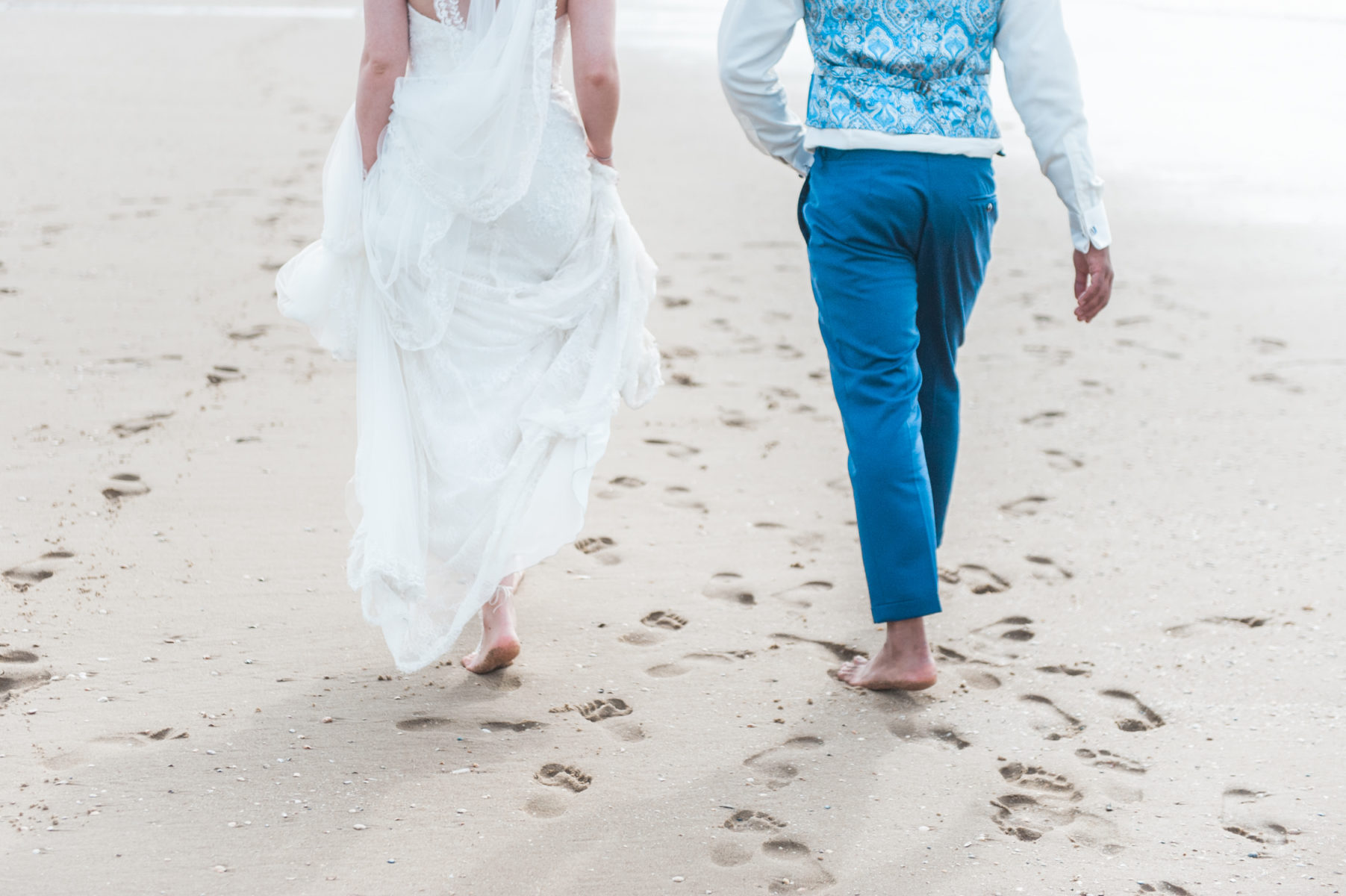an bride and groom on Scheveningen beach captured by a wedding photographer