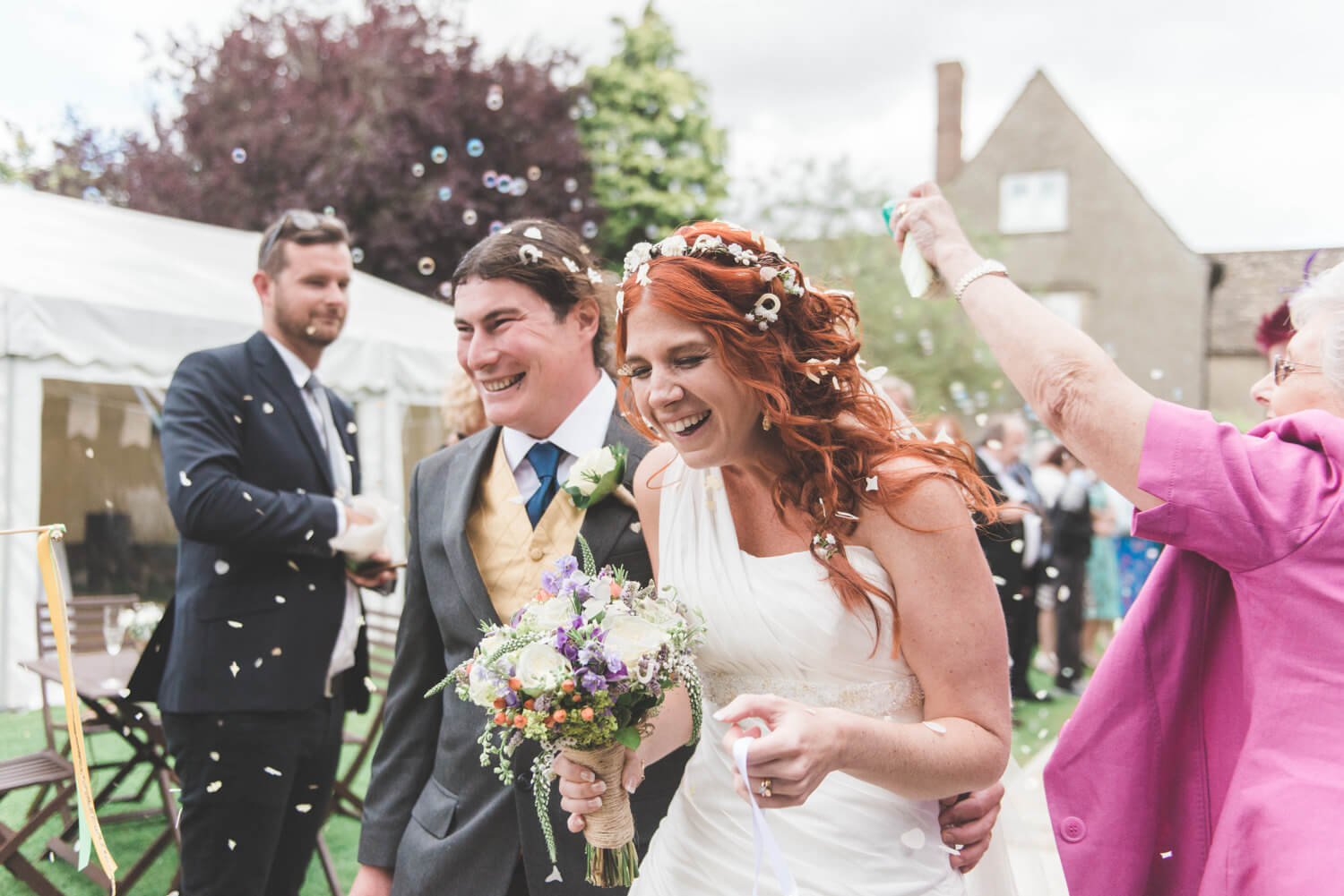 Confetti shot of a bride and broom captured by a UK destination wedding photographer