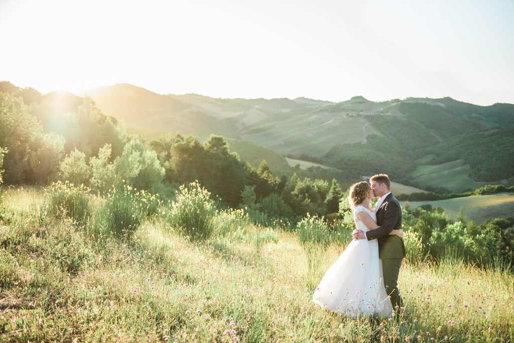 A bride and groom captured during golden hour in Le Marche in Italy