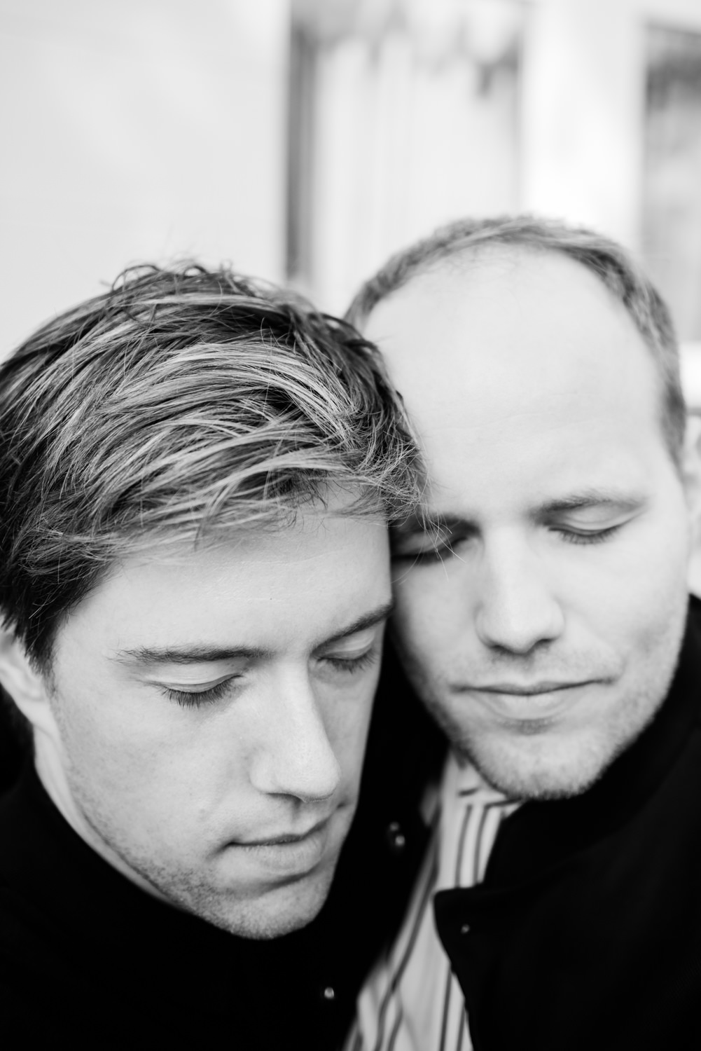 Black and white shot of two grooms on their wedding day