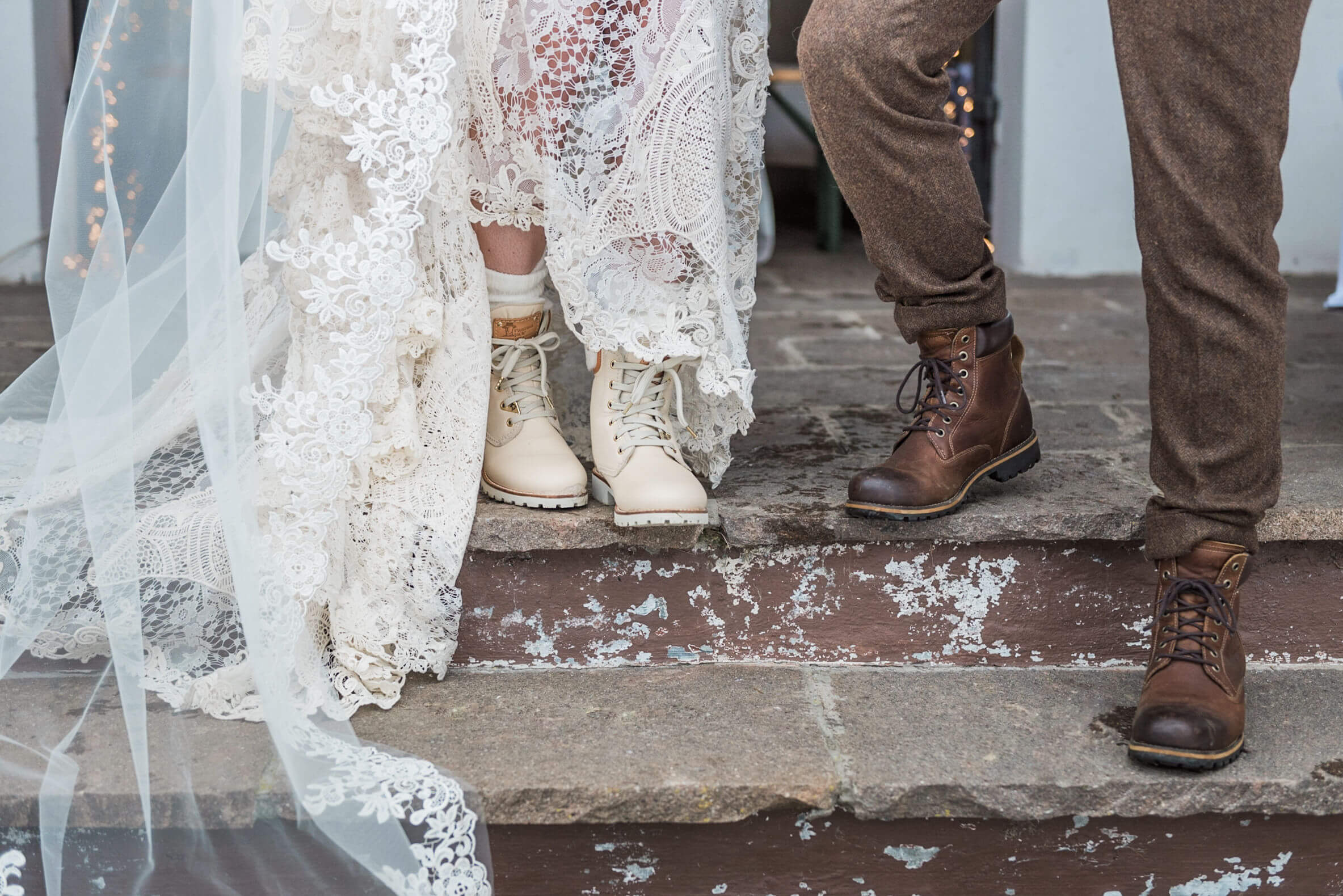 Shoes worn by a bride and groom at their destination winter wedding