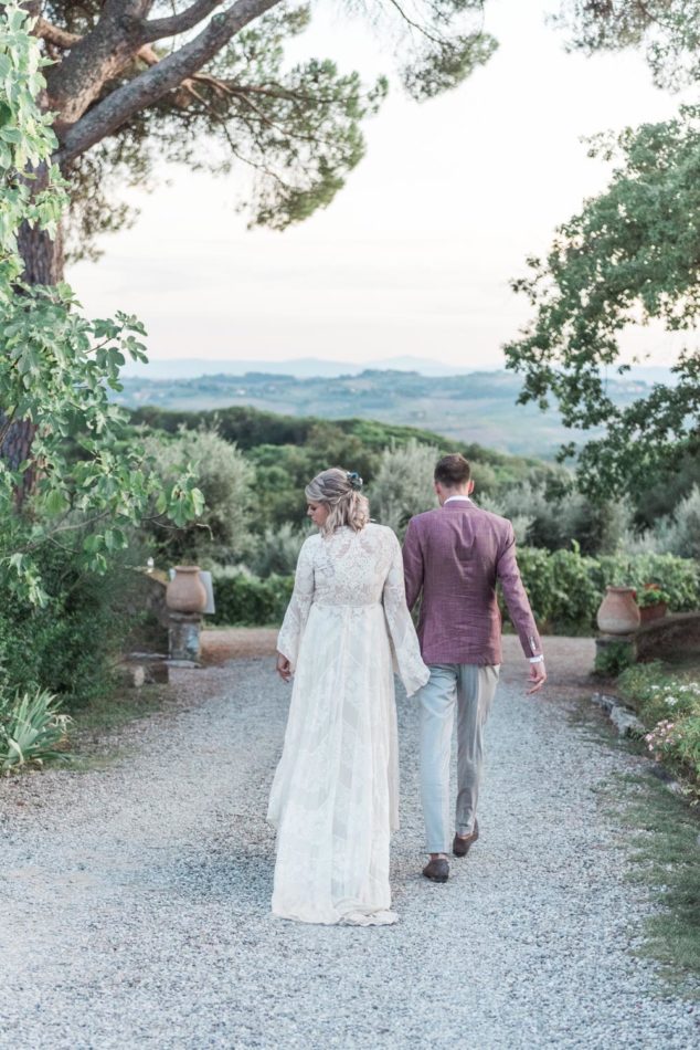 A bride, groom and a stunning view at a wedding in Siena, Tuscany