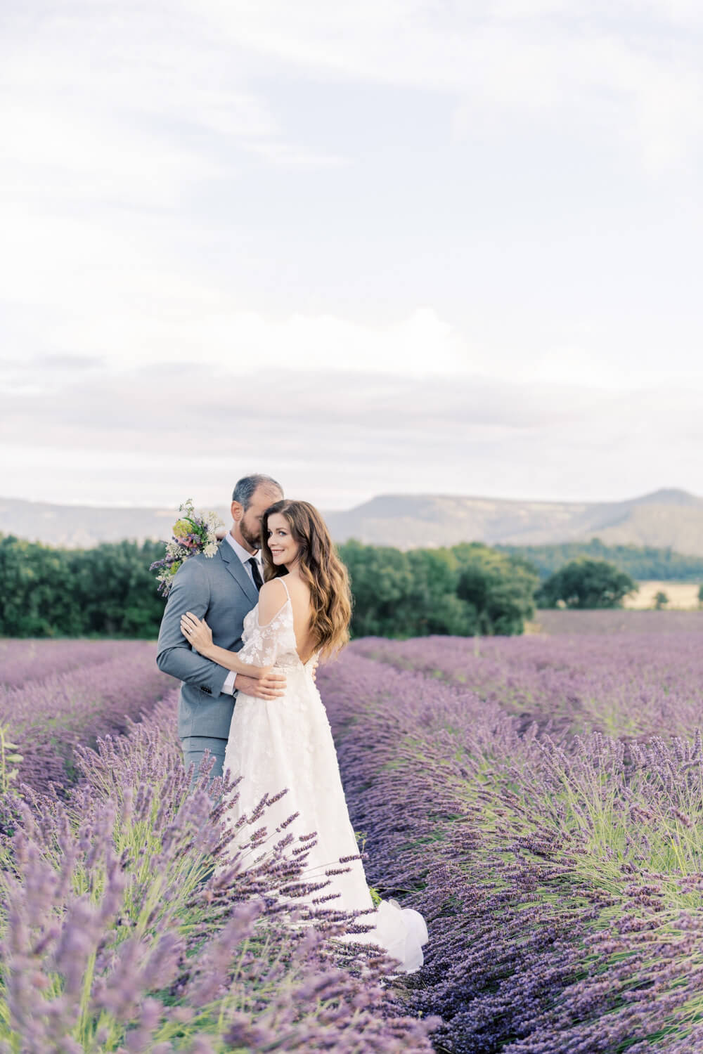 a bridal couple in the lavender fields of Provence during their elopement