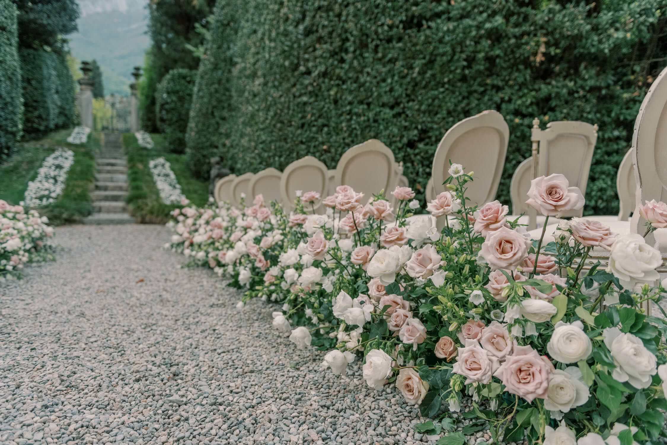 Abundant flowers in a ceremony setting at Lake Como